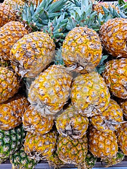 Mexico, Cancun, display of pineapples in a supermarket