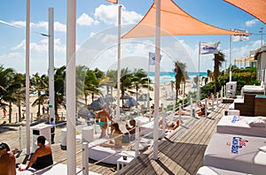 Mexico, Cancun. Group of young people relaxing and sunbathing in the pool. Cancun Grand Pyramid entertaining c