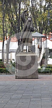 Mexico city, Mexico. December 06, 2020. Coyoacan downtown. Monument of Miguel Hidalgo with a face mask