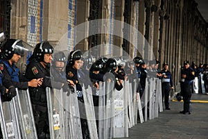 Mexico City, Mexico - November 24, 2015: Mexican Police Officers in Riot Gear outside building in Zocalo Square, Mexico City