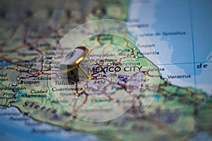 Mexico City pinned on a map with the flag of Mexico