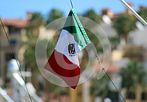 Mexico flag in sailing boating in ocean, ship at sea close up high quality image luxury experience photo