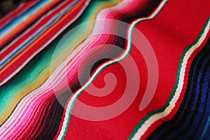 Mexico Mexican traditional cinco de mayo rug poncho fiesta background with stripes photo