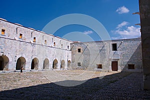 Mexico Oaxaca Santo Domingo monastery courtyard with lonely woman
