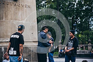 MEXICO - SEPTEMBER 20: Young men having a rap battle at the Beethoven Plaza in downtown while a crowd of people listens