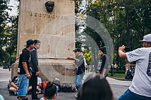 MEXICO - SEPTEMBER 20: Young men having a rap battle at the Beethoven Plaza in downtown while a crowd of people is watching and li