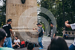 MEXICO - SEPTEMBER 20: Young men having a rap battle at the Beethoven Plaza in downtown while a crowd of people is watching