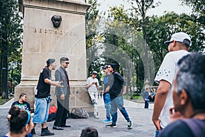 MEXICO - SEPTEMBER 20: Young men having a rap battle at the Beethoven Plaza in downtown while a crowd of people is watching