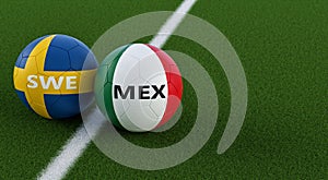 Mexico vs. Sweden Soccer Match - Soccer balls in Mexicos and Swedens national colors on a soccer field.