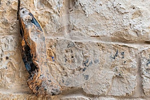 Mezuza scroll on a stone wall doorway in Israel