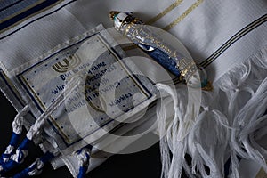 Mezuzah scrolls on a beautiful white tallit