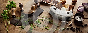 Mezzaluna knives on table with greens photo