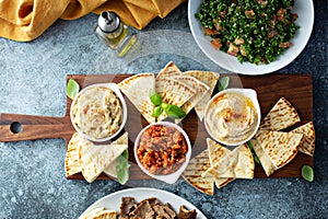 Mezze board with pita and dips photo
