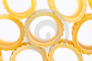 Mezzi rigatoni - italian pasta - unconventional close up - white background