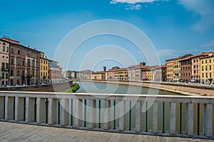 Mezzo Bridge over the Arno River seen Buildings on the banks of the Arno River in Pisa, Italy