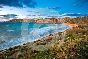 Mgarr, Malta - The famous Ghajn Tuffieha bay at blue hour on a long exposure shot photo