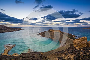 Mgarr, Malta - Panorama of Gnejna bay, the most beautiful beach in Malta at sunset