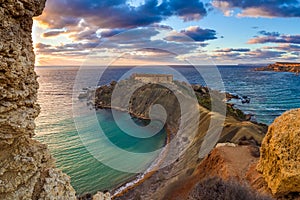 Mgarr, Malta - Panorama of Gnejna and Ghajn Tuffieha bay, the two most beautiful beach in Malta at sunset