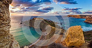 Mgarr, Malta - Panorama of Gnejna and Ghajn Tuffieha bay, the two most beautiful beach in Malta at sunset photo