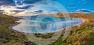 Mgarr, Malta - Panoramic skyline view of the famous Ghajn Tuffieha bay at blue hour