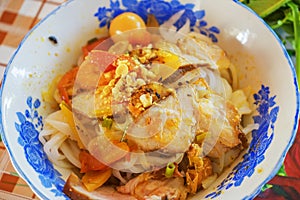 Mi Quang noodle with meat, vegetable, fish, chicken and spices