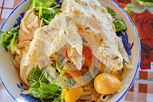 Mi Quang noodle with meat, vegetable, fish, chicken and spices