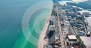 Miami Beach city with high luxury hotels and sandy beachfront. Aerial view of the Atlantic coast in Florida