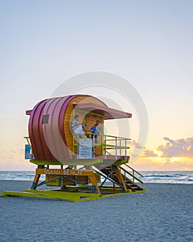 Miami beach, couple on the beach at Miami beach, life guard hut Miami beach Florida