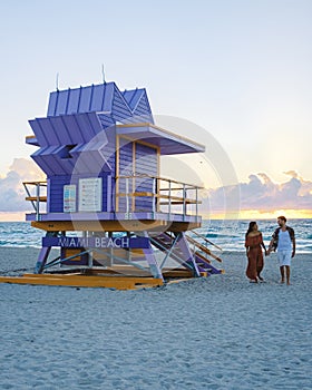 Miami beach, couple on the beach at Miami beach, life guard hut Miami beach Florida