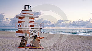 Miami beach, couple on the beach at Miami beach, life guard hut Miami beach Florida