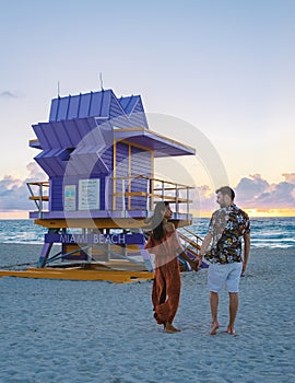 Miami beach, couple on the beach at Miami beach, life guard hut Miami beach Florida