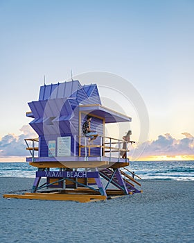 Miami beach, couple on the beach at Miami beach, life guard hut Miami beach Florida