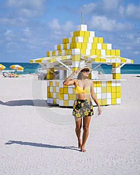 Miami beach, couple on the beach at Miami beach, life guard hut Miami beach Florida