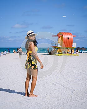 Miami beach, couple on the beach at Miami beach, life guard hut Miami beach Florida