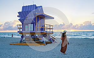 Miami beach, couple on the beach at Miami beach, life guard hut Miami beach Florida