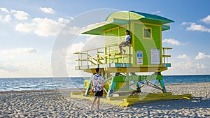 Miami beach, couple on the beach at Miami beach, life guard hut Miami beach Florida