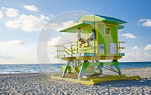 Miami beach, couple on the beach at Miami beach, life guard hut Miami beach Florida