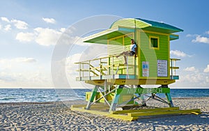 Miami beach, couple on the beach at Miami beach, life guard hut Miami beach Florida