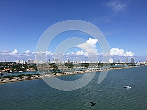 Miami Beach downtown coast bridge palms highway, boat and skyscrappers view from the deck of the cruise ship, Florida, US photo