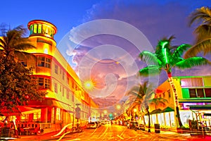 Miami Beach, Florida Moving traffic hotels and restaurants at sunset on Ocean Drive