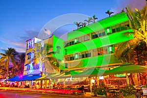 Miami Beach, Florida Moving traffic hotels and restaurants at sunset on Ocean Drive