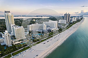 Miami Beach, Florida, USA - Aug 06, 2023: Morning aerial view of luxury condominiums and hotels in Mid-beach