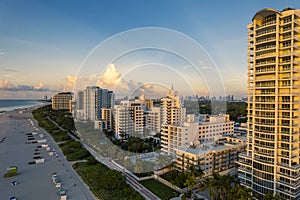 Miami Beach, Florida, USA - Morning aerial view of luxury condominiums and hotels with the Miami skyline in the