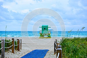 Miami Beach with lifeguard tower and coastline with colorful cloud and blue sky. South Beach. Panorama of Miami Beach