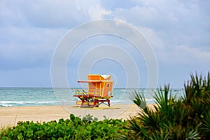 Miami Beach with lifeguard tower and coastline with colorful cloud and blue sky. Travel holiday ocean location concept.