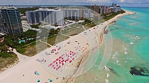 Miami Beach scene aerial panning from ocean to coast