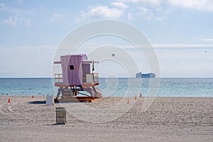 Miami Beach scene with lifeguard tower cruise ship and parasail