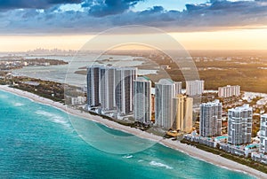 Miami Beach skyscapers and downtown skyline on background