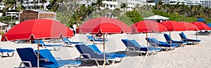 miami beach with sunloungers and umbrellas for summer relax