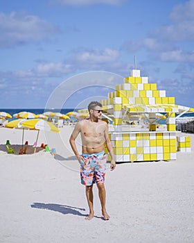 Miami beach, young men on the beach at Miami beach, lifeguard hut Miami beach Florida